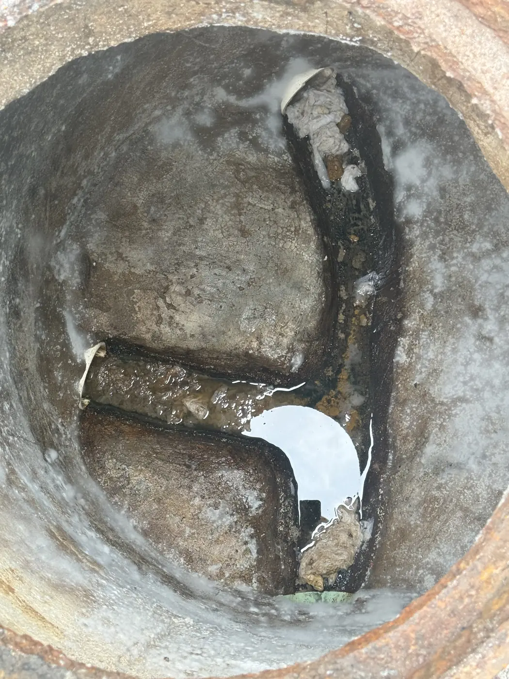 Damaged baffle inside an older concrete tank