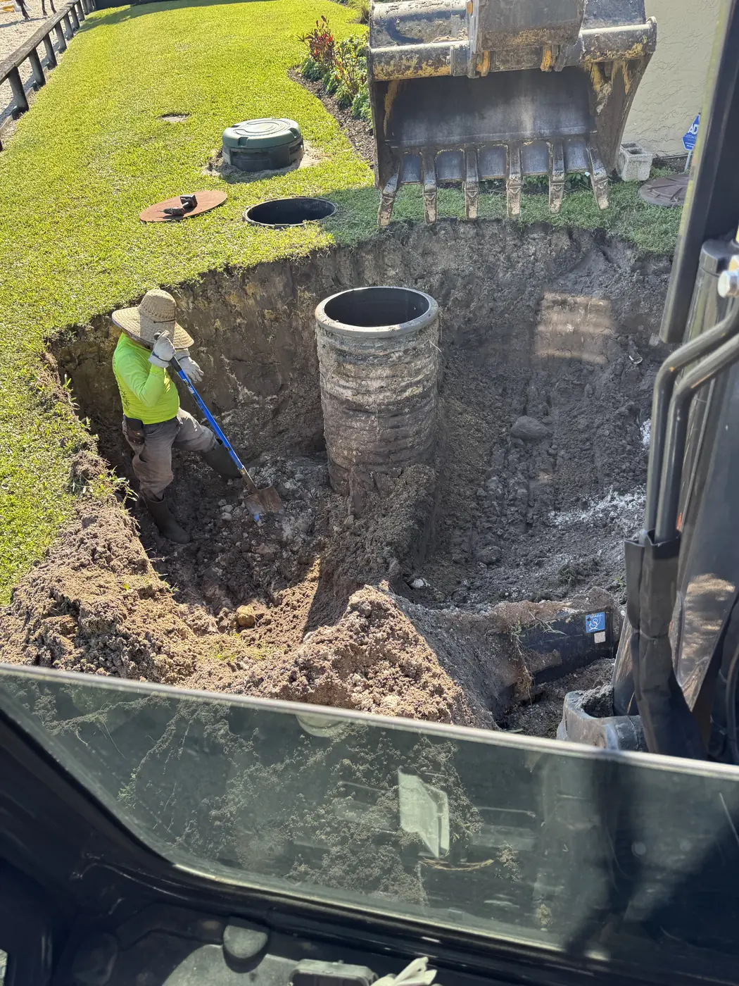 Excavating around a septic tank for replacement